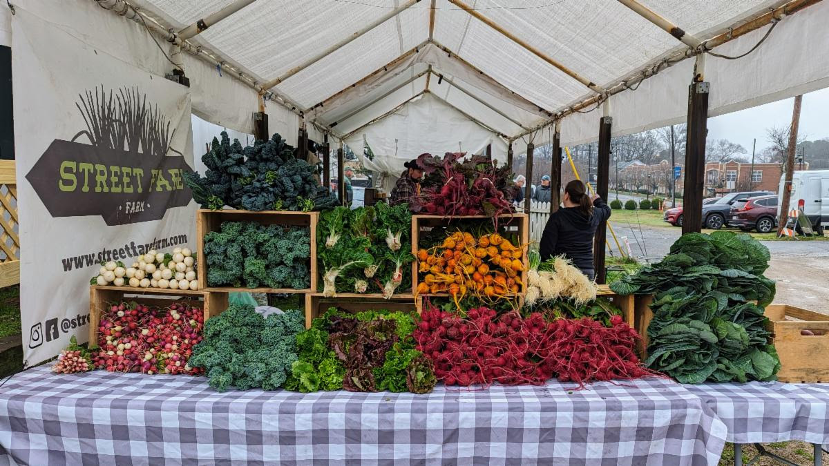 farmers market display of fresh vegetables