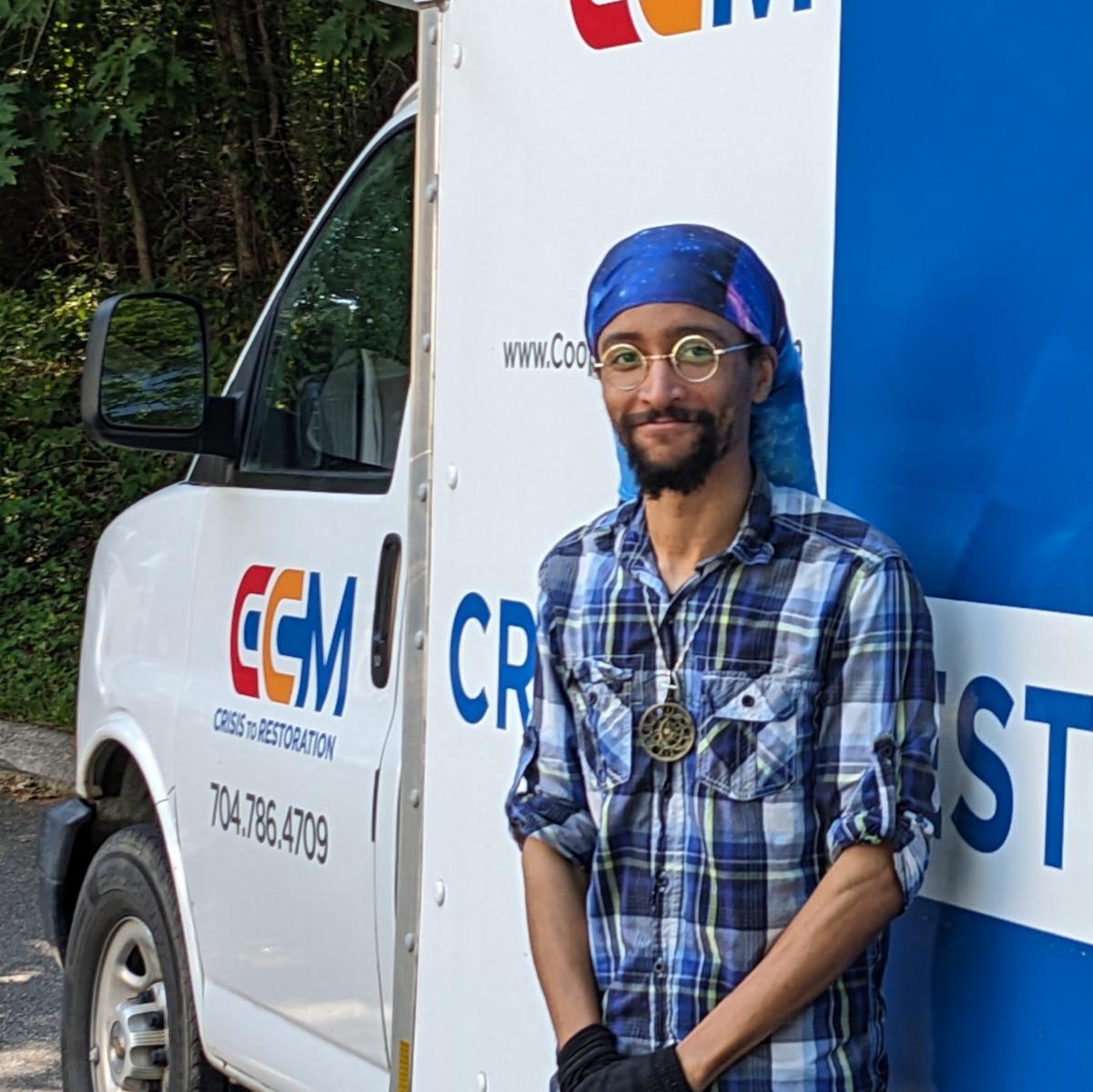 man standing in front of box truck