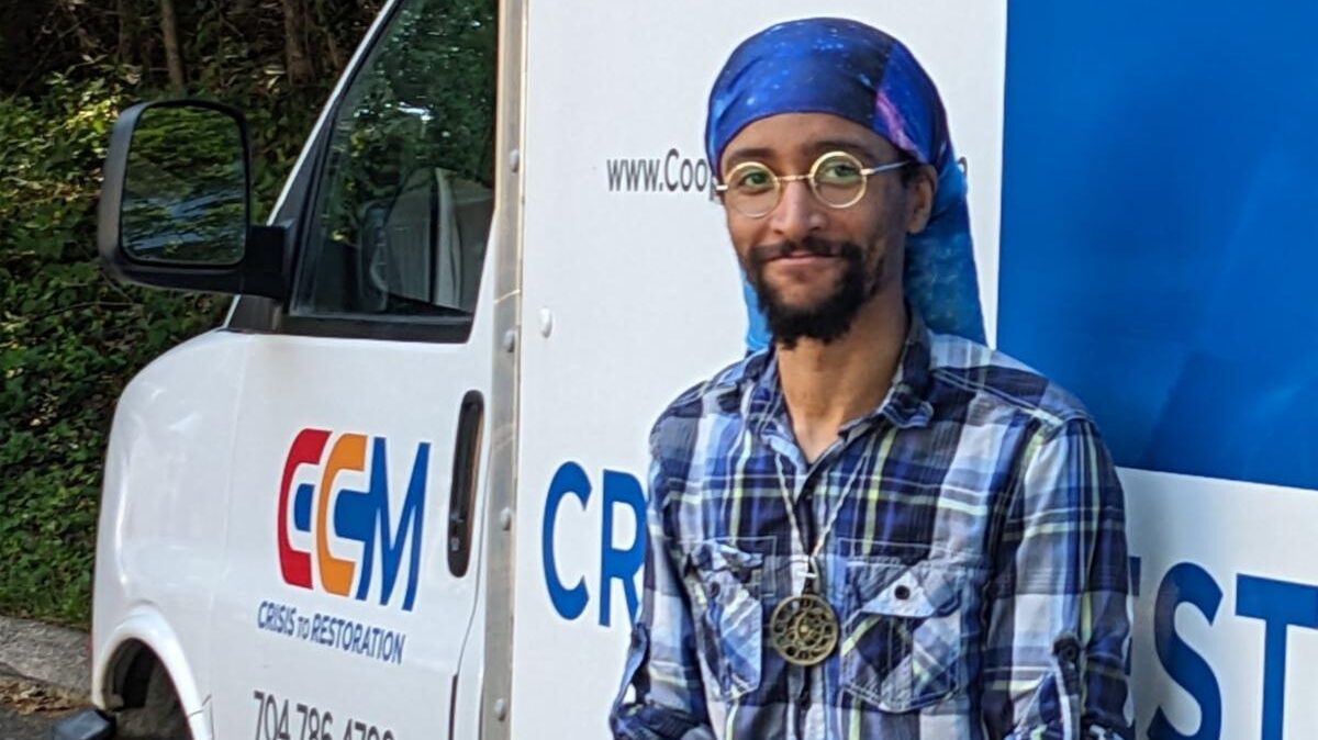 man standing in front of box truck
